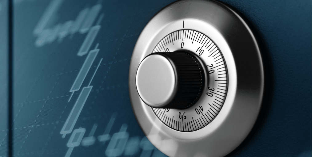 Close up of a silver wheel combination lock on a safe